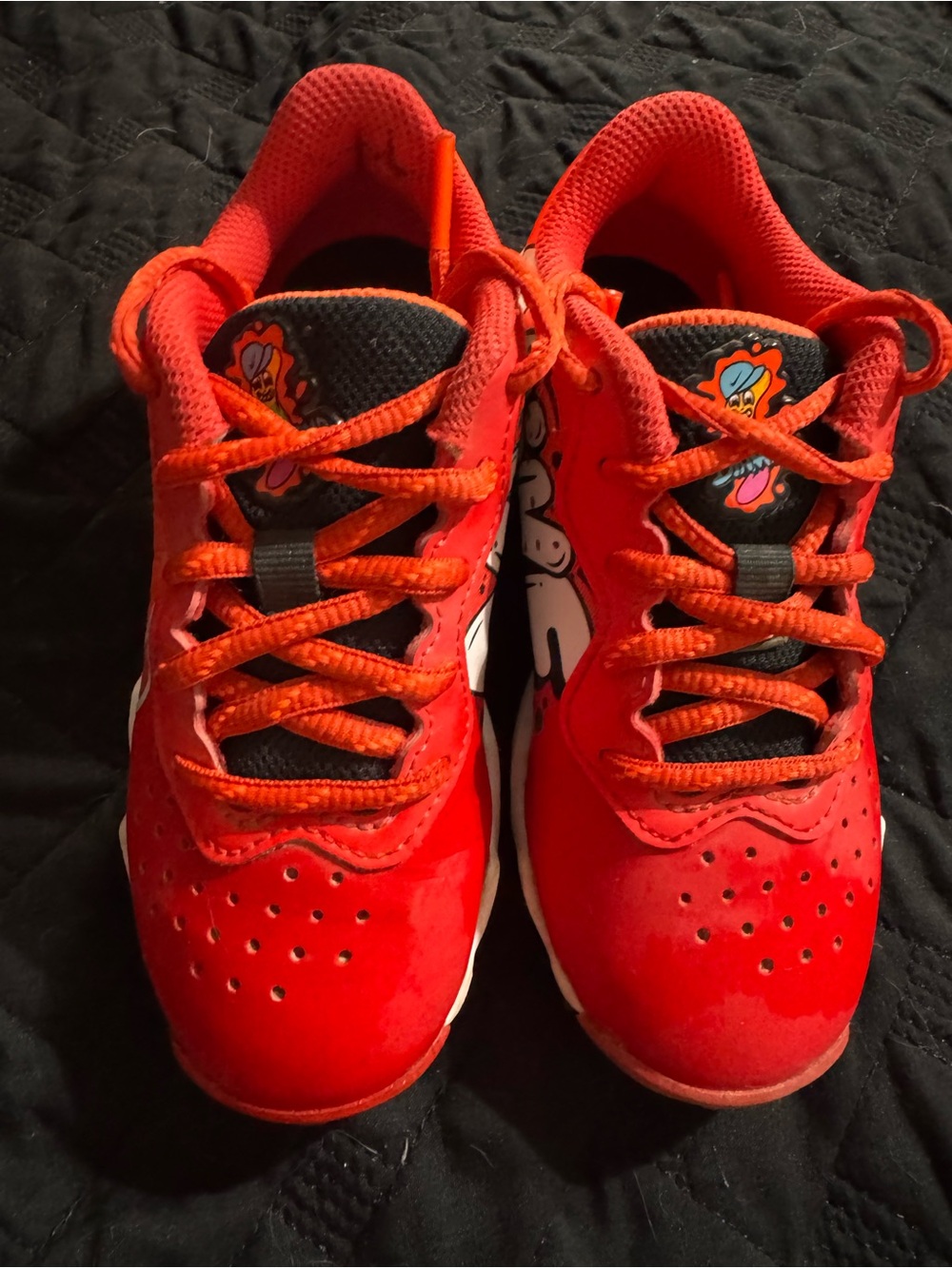 Nike Kids Red Low-Top Sneakers with Black Tongue Accents baseball cleats